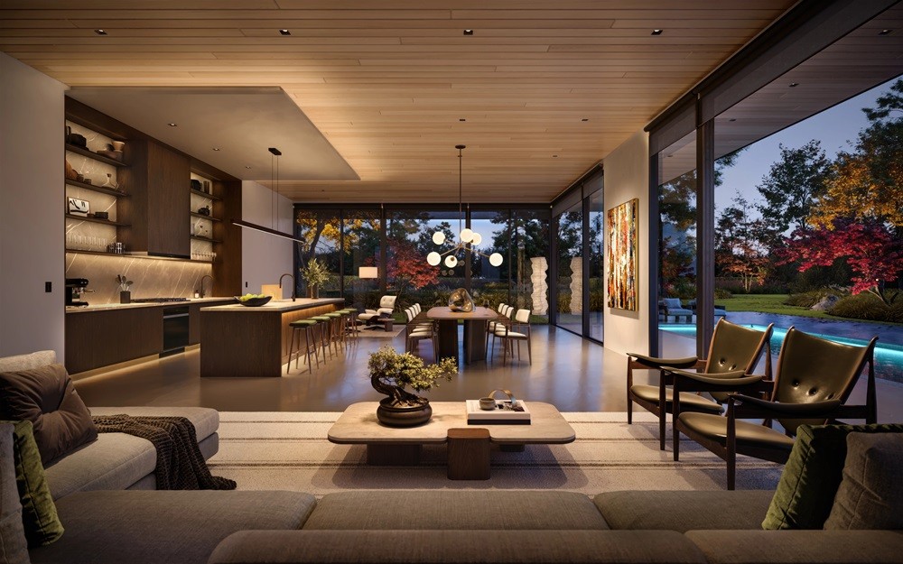 An entryway featuring a wooden staircase and a couch along the hallway.