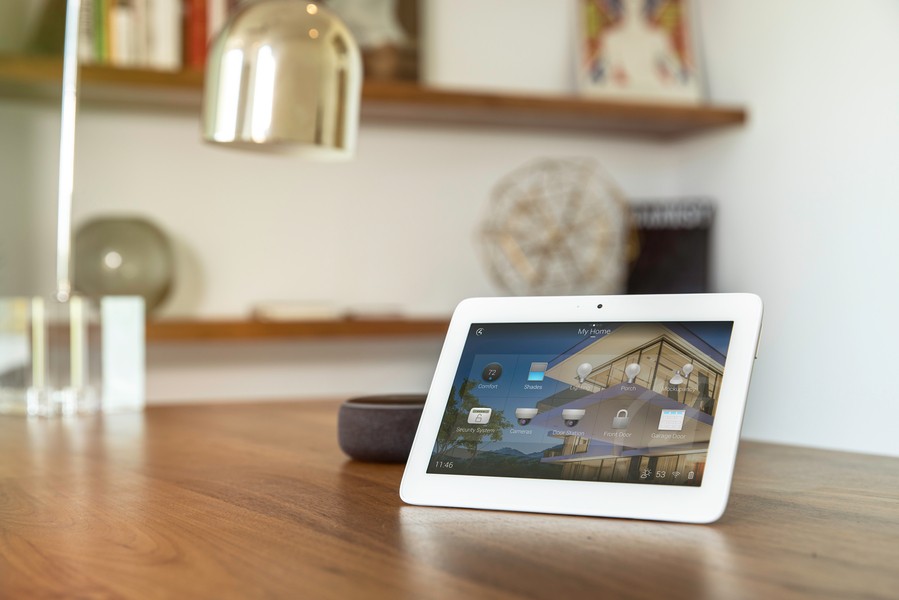 A Control4 touchscreen on a table.