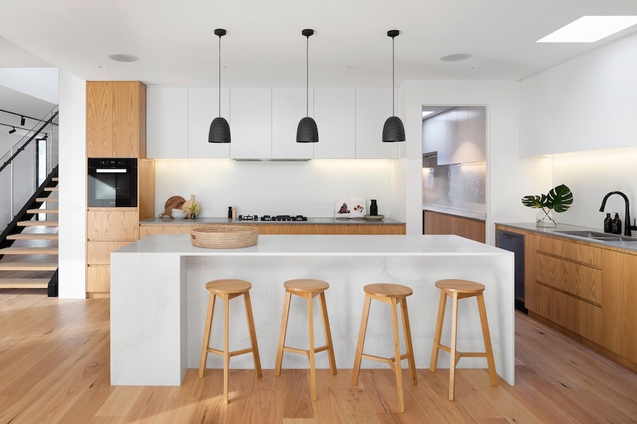 A luxury kitchen equipped with smart lighting and whole-home audio