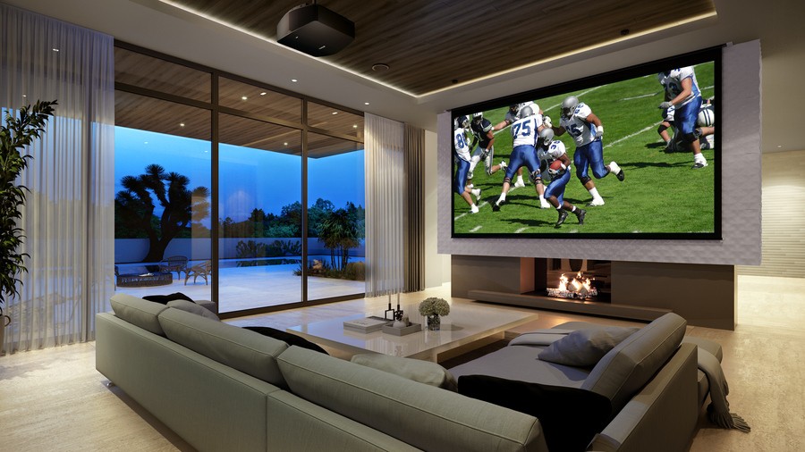 A media room with a projector and motorized shades and a projector displaying a football game.